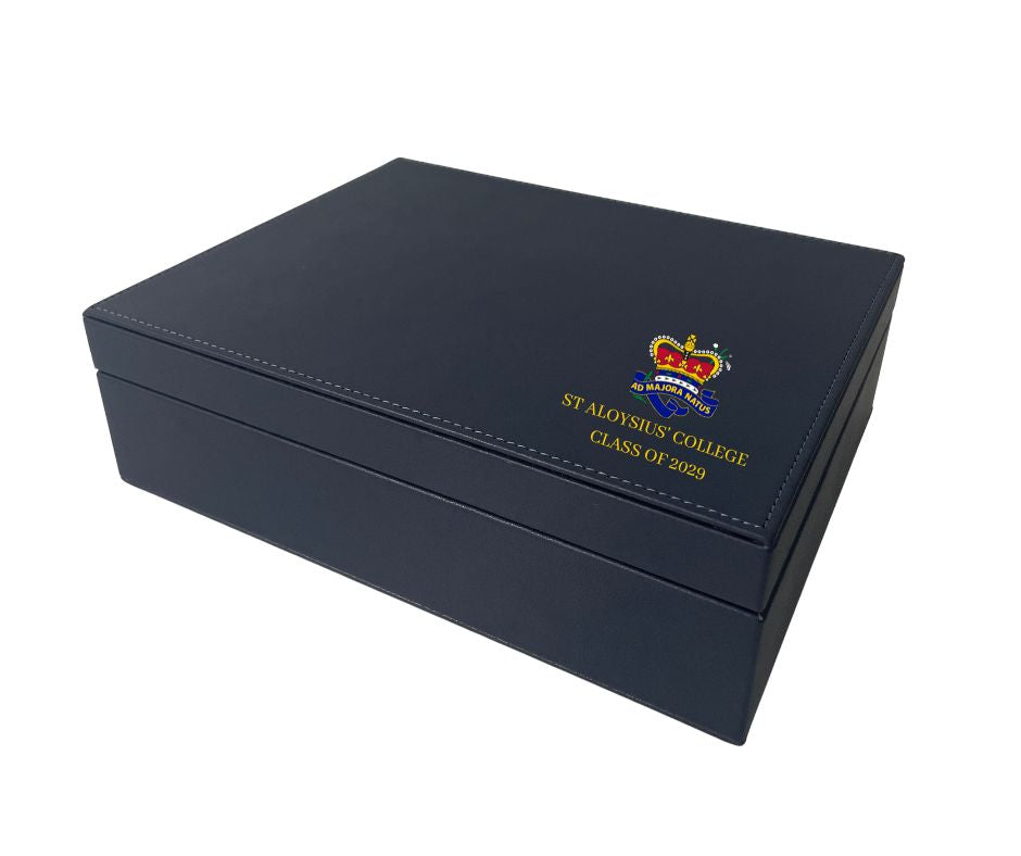 Created for students to fill with small treasures and keepsakes from their school years. Expertly crafted in quality black leather and lined with black faux suede. The inside has 5 separate compartments that can hold letters, ribbons, medals and any other special reminders of your schooling years. Each box is customised with students' graduation year and the St Aloysius' College crest.